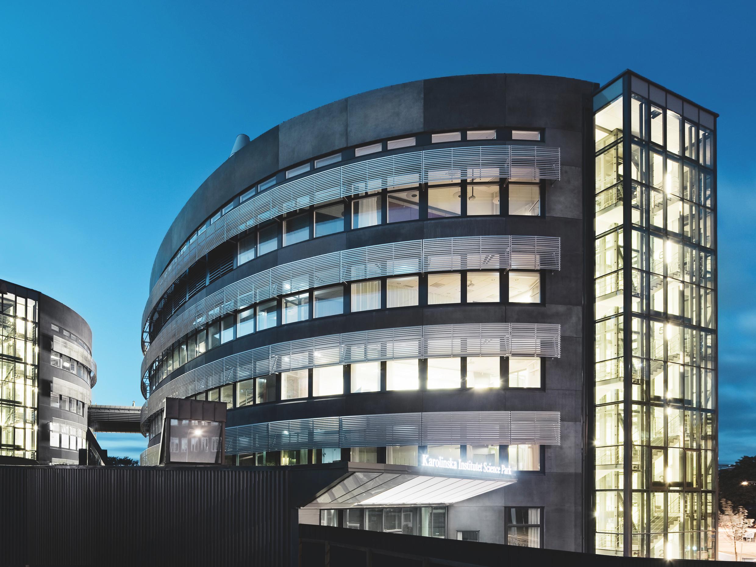 A research building at night.