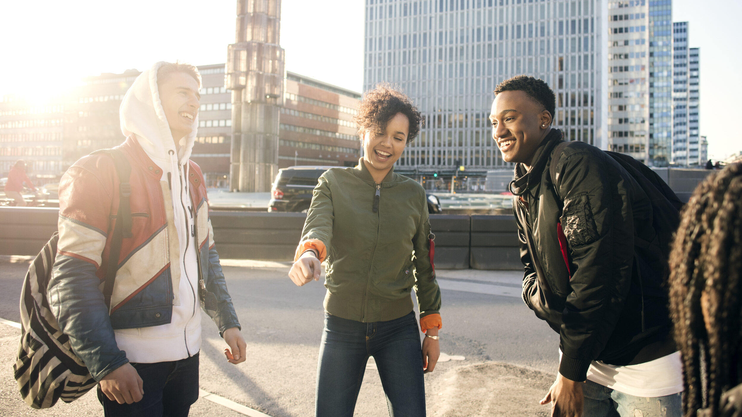 Three young adults hanging out in central Stockholm.