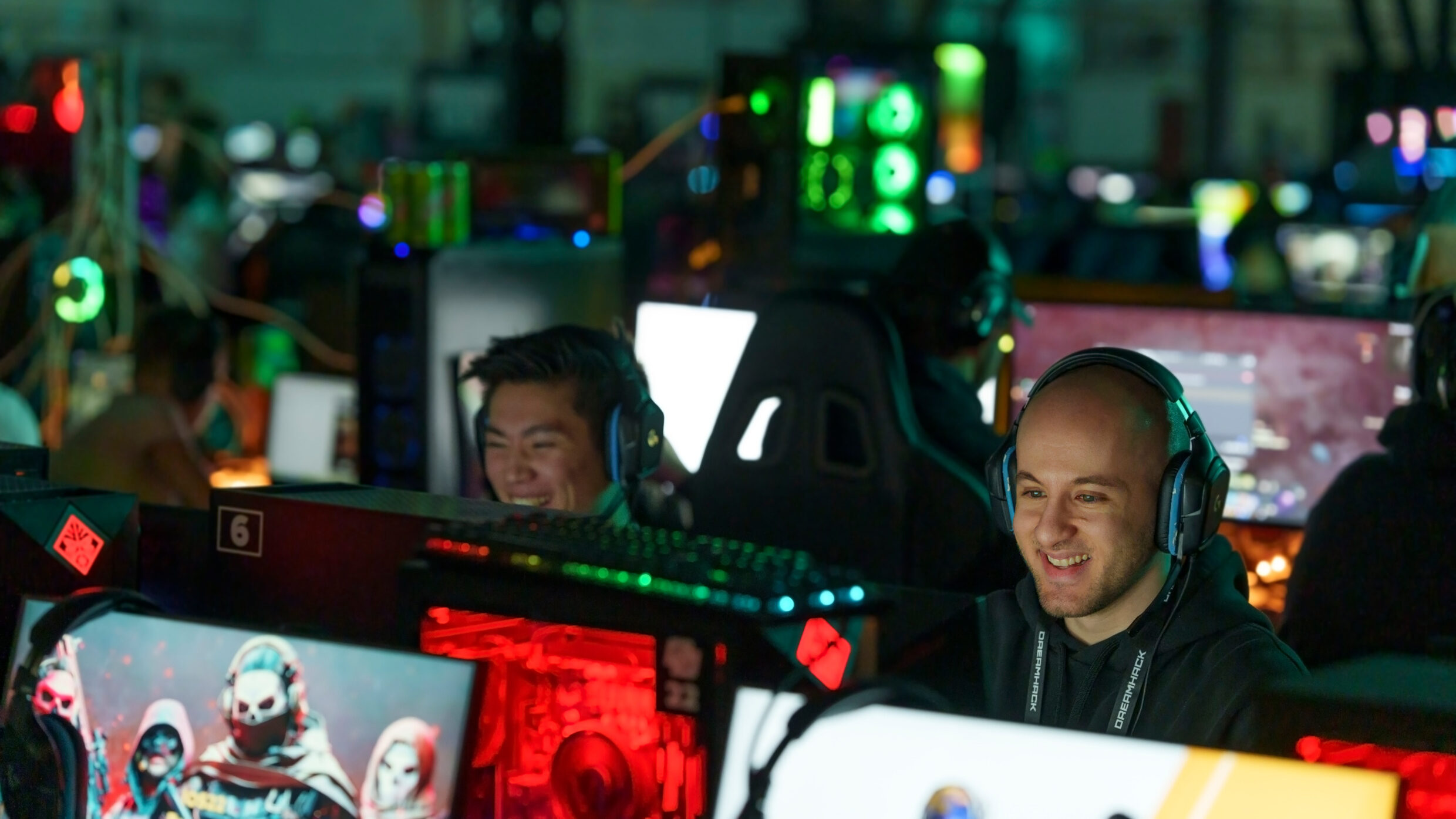 People sit in front of computer screens.