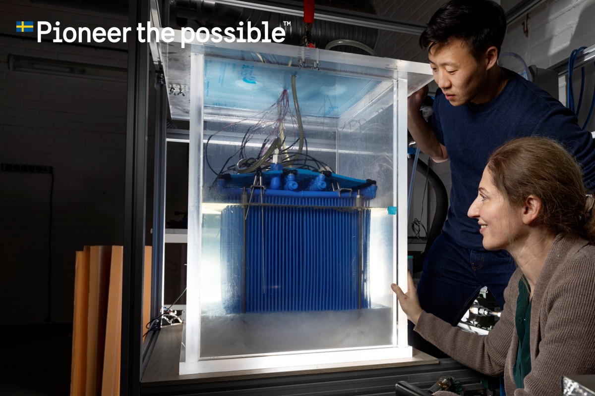 Two scientists with a battery.