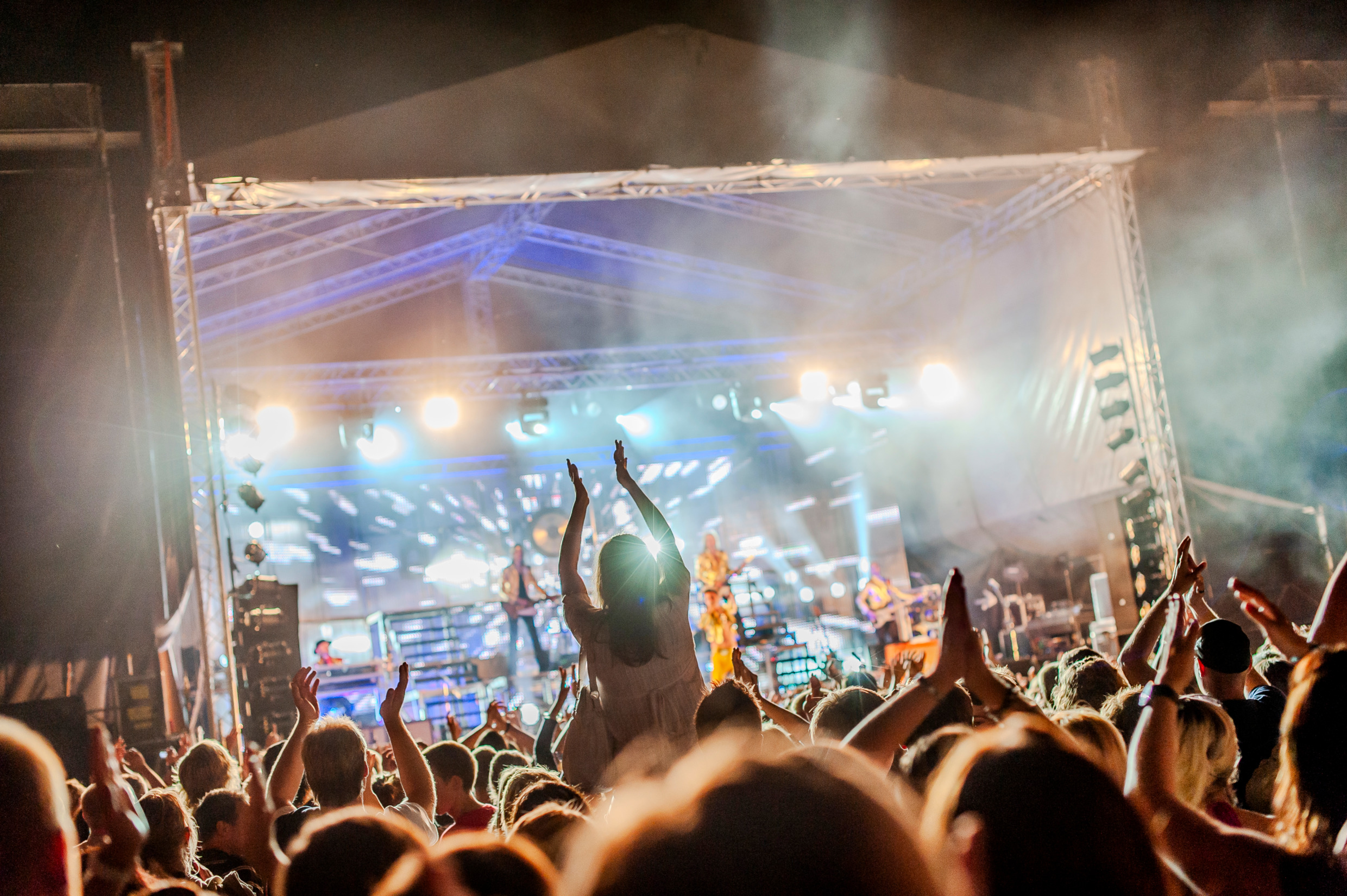 A live music stage with a large audience.